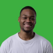 Smiling man in a white t-shirt against a green background